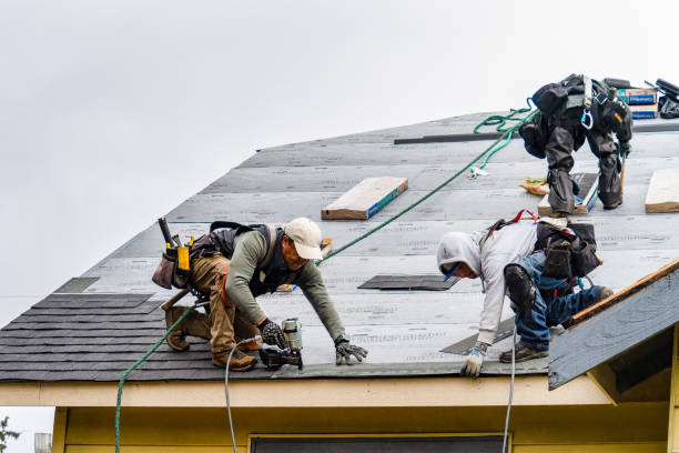 Professional Roofing technician working in Mentcle, PA